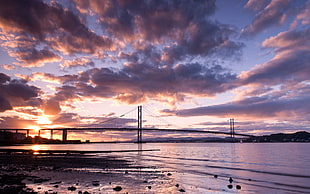 Akashi Kaikyo bridge under the cloudy sky during sunset HD wallpaper