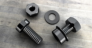 closeup photo of two black screws