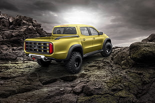 yellow crew cab truck on top of mountain