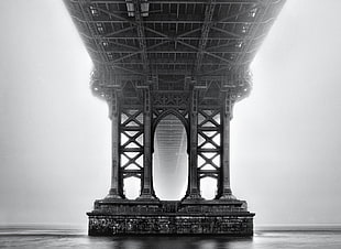 bottom view of bridge in grayscale shot