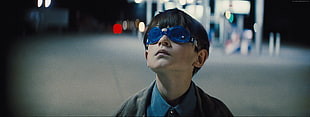boy wearing blue goggles during nighttime