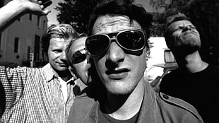 greyscale photo of four men