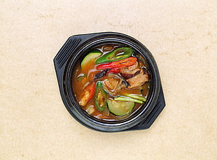 cooked food in black bowl