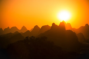 silhouette photography of rock mountains HD wallpaper