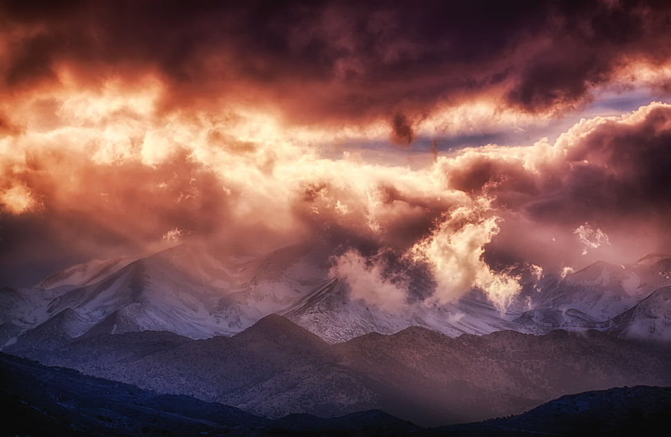 sunlight passing through clouds on top of the mountains HD wallpaper