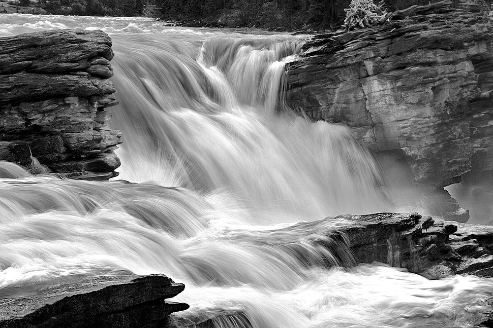 time lapse photography of water falls surrounded by rocks HD wallpaper