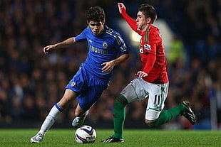selective focus photography of two football players HD wallpaper