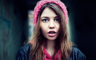 woman with pink beanie showing face