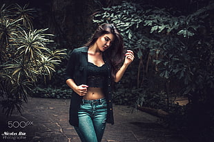 woman wearing crop-top and long-sleeved shirt