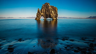 brown island, landscape, water, rock HD wallpaper