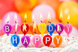 lit happy birthday candle on cake HD wallpaper