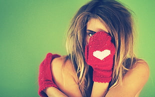 woman wearing pair of red knit gloves