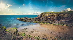 landscape photo of rock formation surrounded by body of water, Ireland, beach, sea