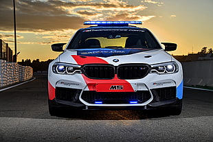 white and red BMW M5 stock car on gray road HD wallpaper