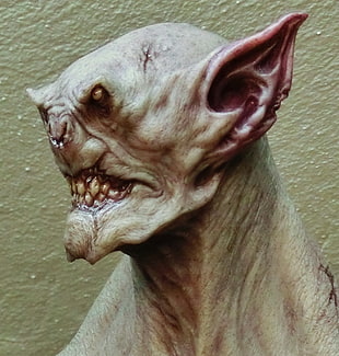 brown alien faux character, goblin