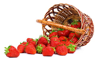 strawberries fruit on brown wicker basket