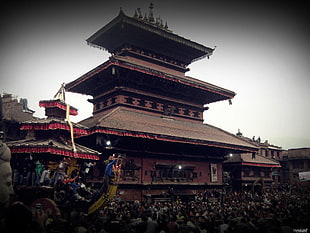 brown and red Chinese temple, Nepal, festivals, culture, crowds