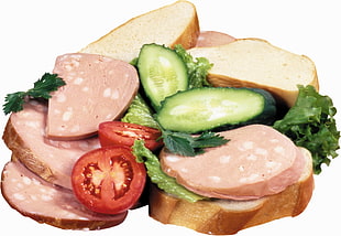 sandwich with ham, tomatoes, and cucumber
