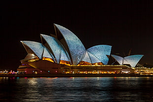 lit Sydney Opera House in Australia at night HD wallpaper