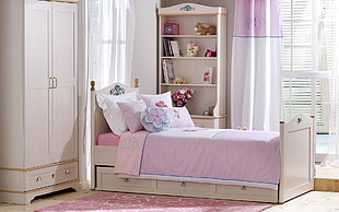white wooden bed frame, wardrobe with shelf and bed pillows