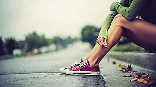 photo of person wearing red low-top sneakers HD wallpaper
