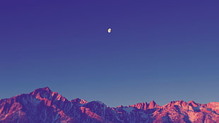 moon over rocky mountain during dusk HD wallpaper