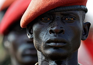 man wearing red hat, South Sudan, soldier