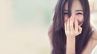 woman touching her nose photography HD wallpaper