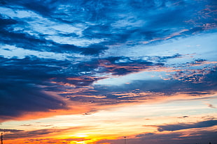 sunset under blue and grey cloudy sky HD wallpaper
