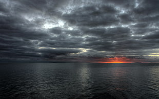black and red wooden table, sea, clouds, sunset, nature