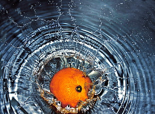 time lapse photo of orange on water