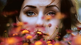 odd-eyed woman at flowers