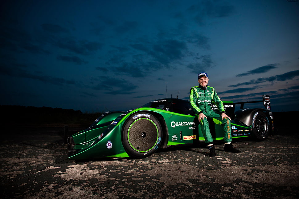 man wearing green racing suit sitting on green sports car digital wallpaper HD wallpaper