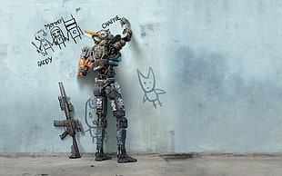 gray robot writing on wall