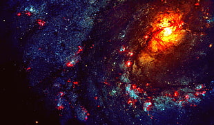 red and blue stars near spiral galaxy