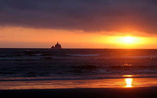 rectangular brown wooden coffee table, sunset, sun rays, beach, lighthouse