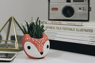 red and white animal hear-themed plant pot