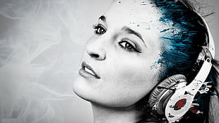 woman wearing white Beats headphones