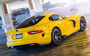 photograph of yellow luxury car