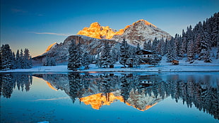 mountain and trees reflects on calm lake water at daytime, mountains, snow, reflection
