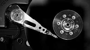 grayscale photo of vinyl recorder and turntable