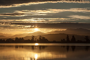 calm body of water, New Zealand, landscape, sunset, sun rays