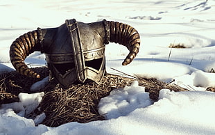 Dragonborn helmet on snowy field HD wallpaper