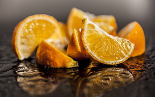 shallow focus photography of sliced orange