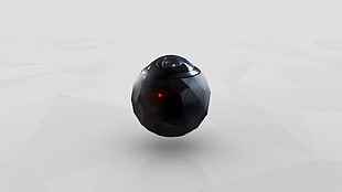 round black camera with white background