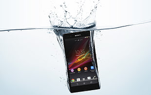 black Sony Xperia water proof deep in water HD wallpaper