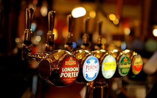 assorted beer tap handles, beer, macro, bars