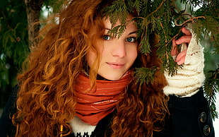 woman holding pine tree