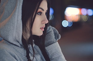 woman wearing gray hoodie