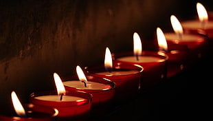 container candles lit arranged in a single line HD wallpaper